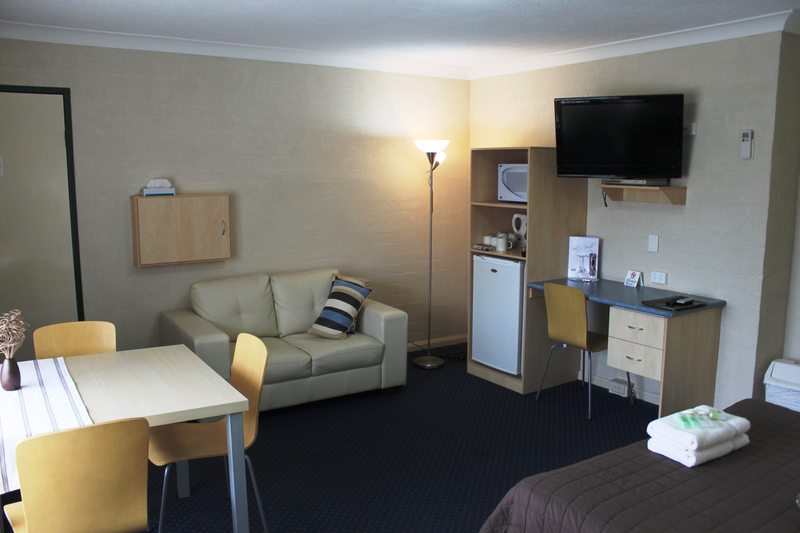 Luxury room with comfortable bed at Poet's Recall Motel